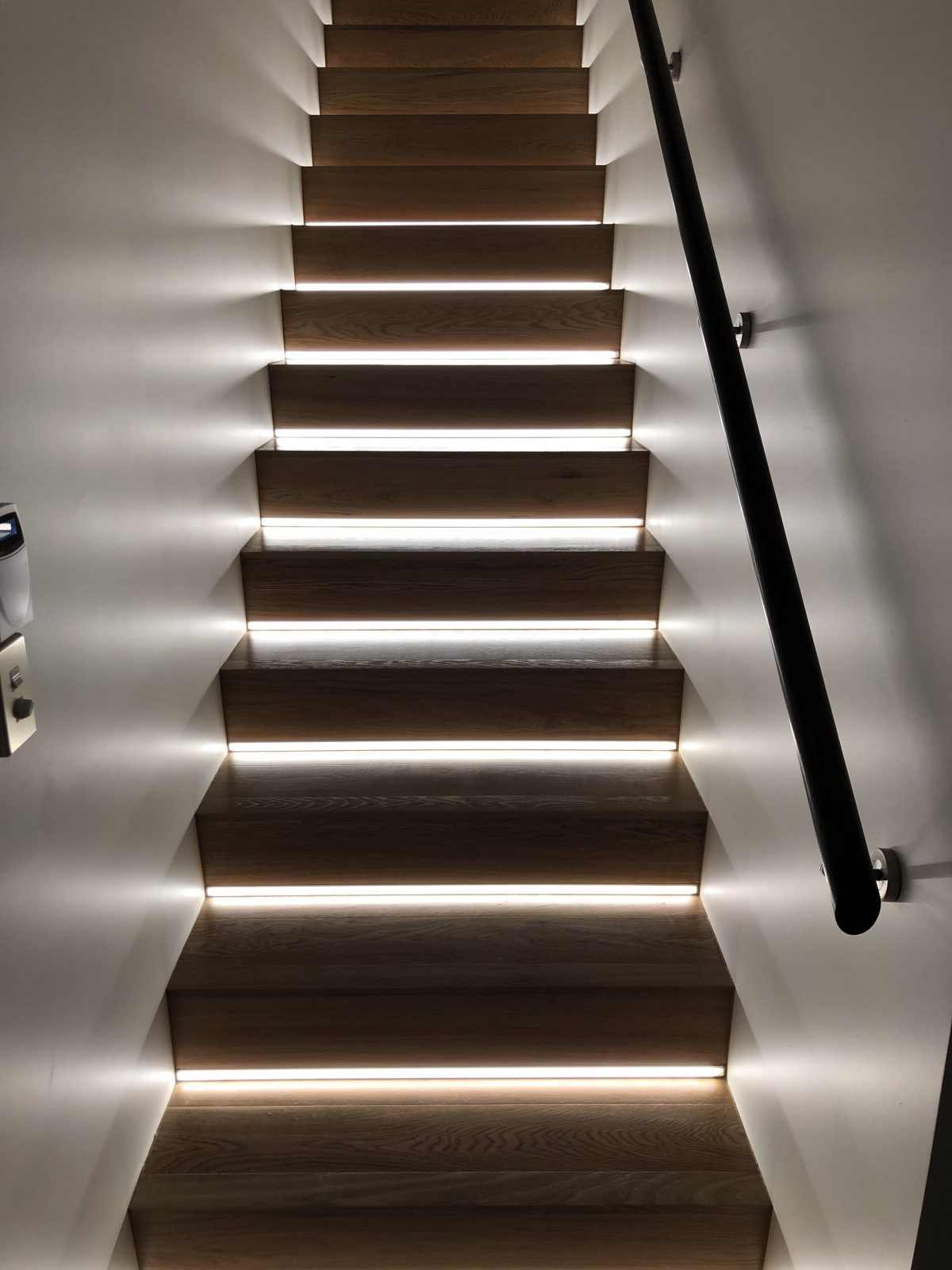 LED strip lights set into stair risers. Astrum Lighting and Design